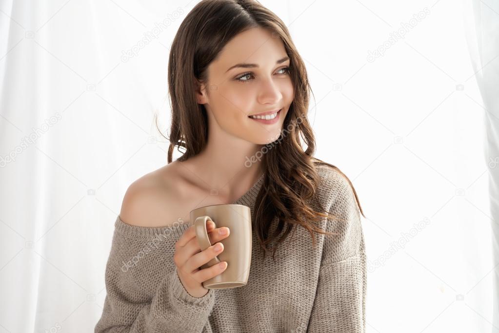 Closeup of girl with cup enjoying new day