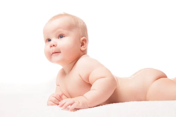 Cute baby lying on white blanket — Stock Photo, Image