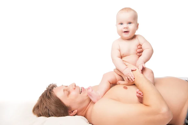 Happy kid boy and his dad lying on the floor — Stock Photo, Image