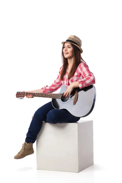 Woman is sitting and playing her guitar. — Stock Photo, Image