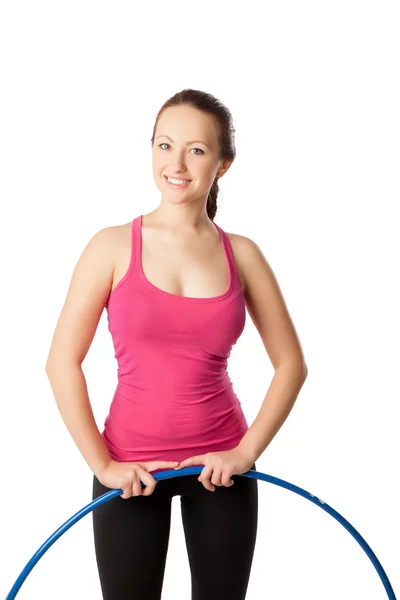 Young woman standing with hula hoop down. Half- length view — Stock Photo, Image