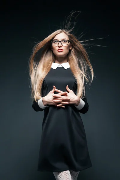 portrait of blonde woman wearing glasses