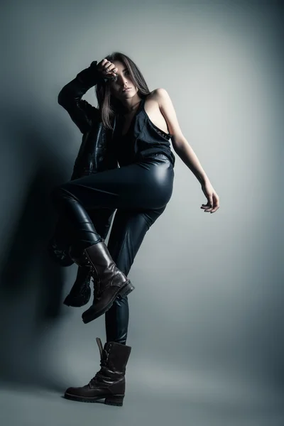 Fashion model wearing leather pants and jacket — Stock Photo, Image