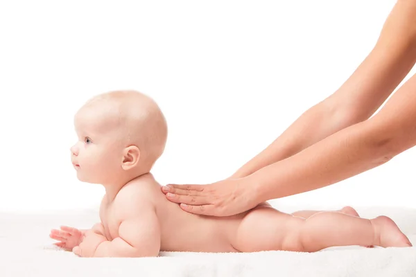 Cute baby lying. hands massaging his back — Stock Photo, Image