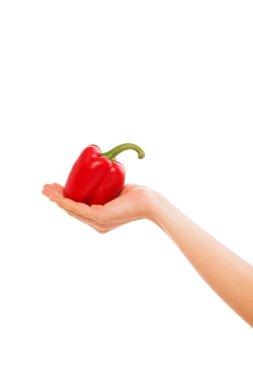 Beyaz arka plan üzerinde izole bir biber tutan el