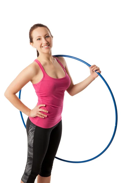 Closeup of young woman standing with hula hoop on her shoulder — Stock Photo, Image