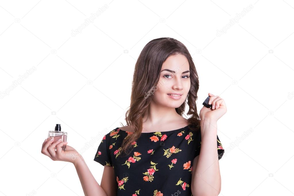 young woman enjoying a smell of the perfume