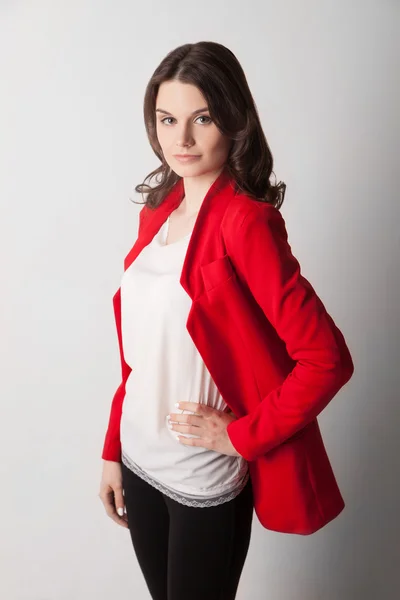 Young beautiful woman in red jacket — Stock Photo, Image