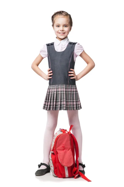 Beautiful little girl in school uniform isolated on white — Stock Photo, Image