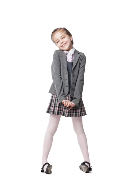 Gyönyörű kicsi lány iskola egységes elszigetelt fehér — Stock Fotó
