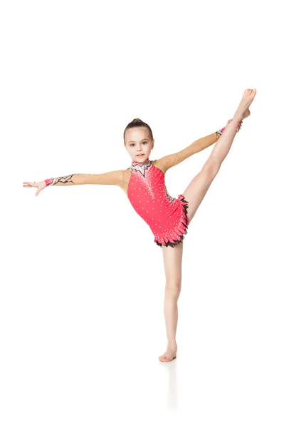 Całkiem mała dziewczynka robi Gimnastyka na białym tle — Zdjęcie stockowe