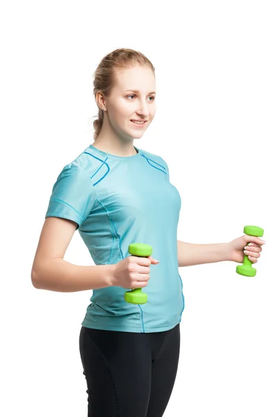 Athletic young woman works out with green dumbbells — Stock Photo, Image