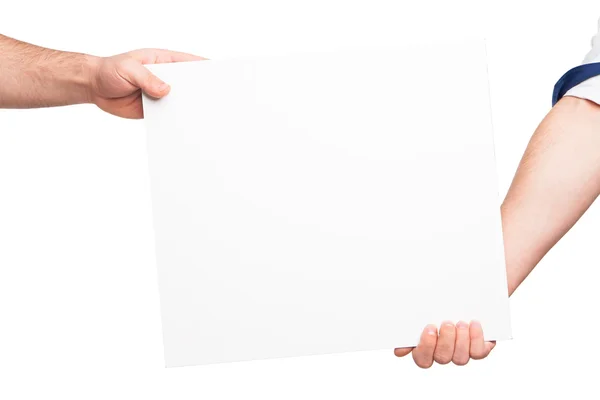 Hands holding a blank white board — Stock Photo, Image