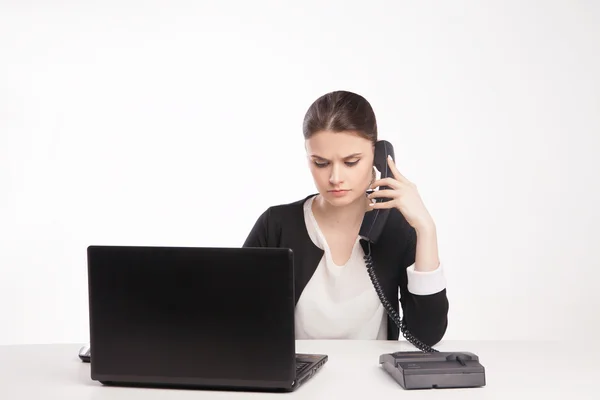 Portrait of worried businesswoman talking on the phone — Stok fotoğraf