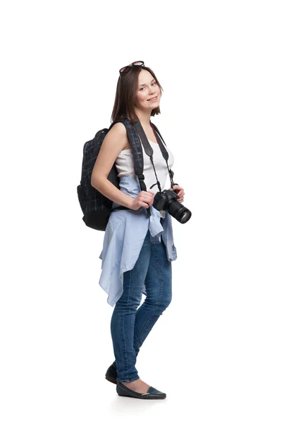 Young woman tourist with camera and backpack — Stock Photo, Image