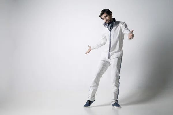 Portrait of an emotional young man wearing white. — Stock Photo, Image