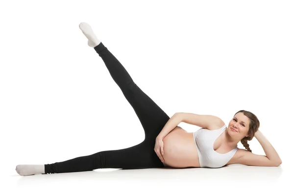 Sports pregnant woman doing stretching exercise — Stock Photo, Image