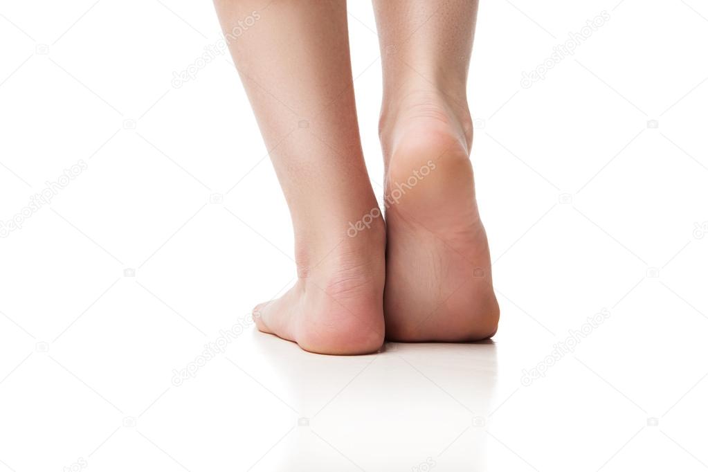 Back view of woman foot on white background, isolated, close-up