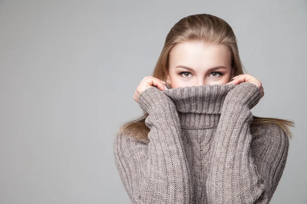 Beautiful blond young girl wears winter pullover — Stock Photo, Image