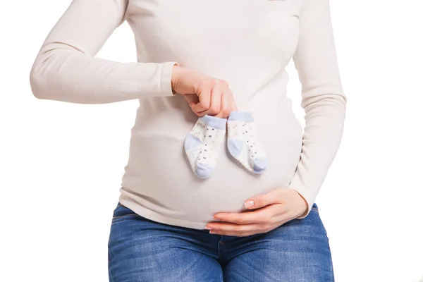 Hands of happy pregnent woman holding child socks — Stock Photo, Image