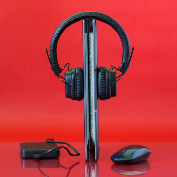 Laptop Stands Headphones Computer Mouse External Hard Drive Red Background — Stock Photo, Image