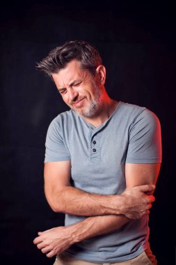 Man feels elbow pain. People, healthcare and medicine concept clipart