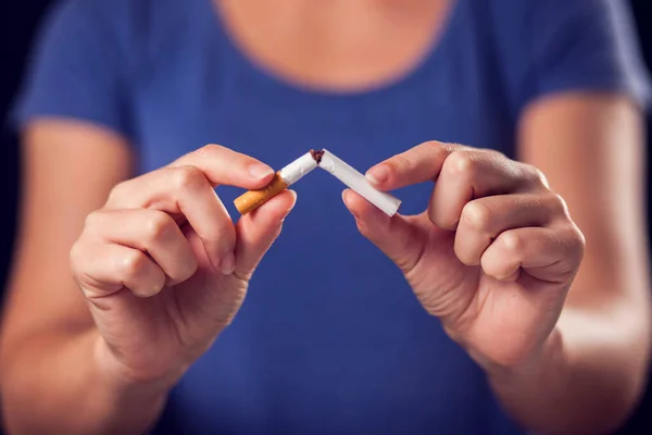 Woman Blue Shirt Holding Broken Cigarette Hands Stop Smoking Concept — Stock Photo, Image