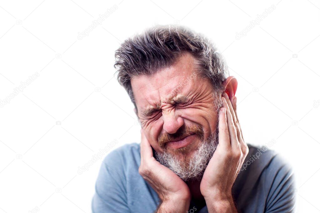 Man feels strong ear pain isolated. People, healthcare and medicine concept 