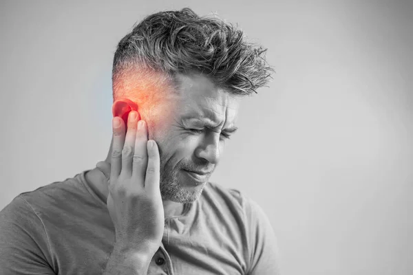 Male Having Ear Pain Touching His Painful Head Isolated Gray Royalty Free Stock Photos