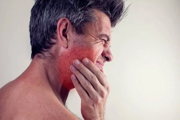 Man feels strong tooth pain. People, healthcare and medicine concept.