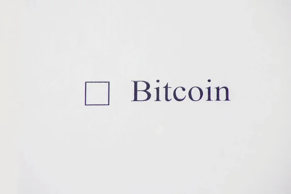 Checklist box - Bitcoin word on white paper. Check form and cryptocyrrency concept