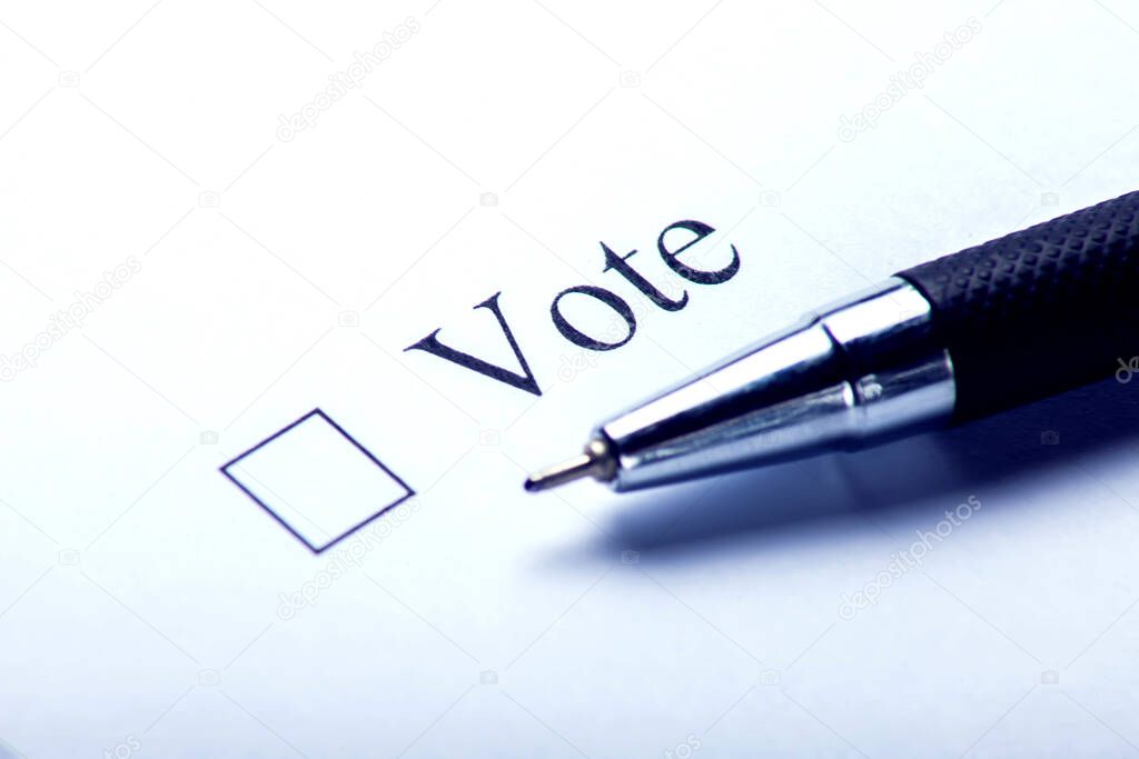 Vote - checkbox with a cross on white paper. Checklist concept.