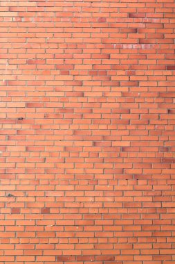 Dikey kırmızı tuğlalar arka plan. Binanın duvarının bir parçası.