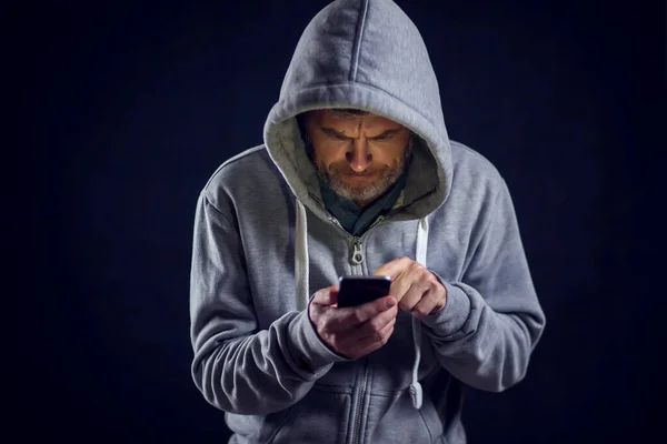 Man Hooded Sweater Holds Phone Hands People Gadget Concept — Stock Photo, Image