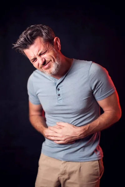Man feels stomach pain. People, healthcare and medicine concept