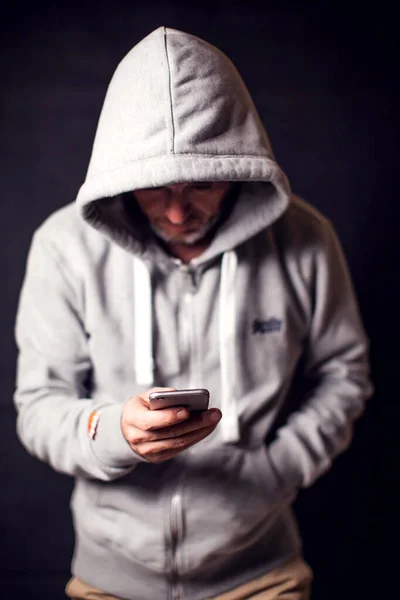 Man Wearing Hoody Sweater Mobile Phone Hands Crime Hacking Concept — Stock Photo, Image