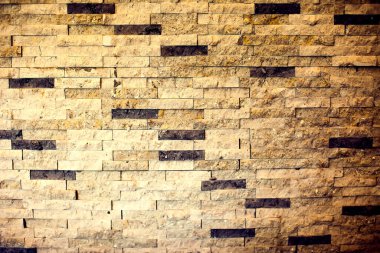 Eski taş tuğla duvar dokulu arka planda yakın yüzey tuğlası deseni