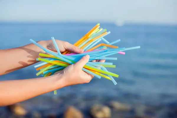 Close Handsholding Plastic Straws Polluting Beach Environmental Pollution Concept Stock Picture