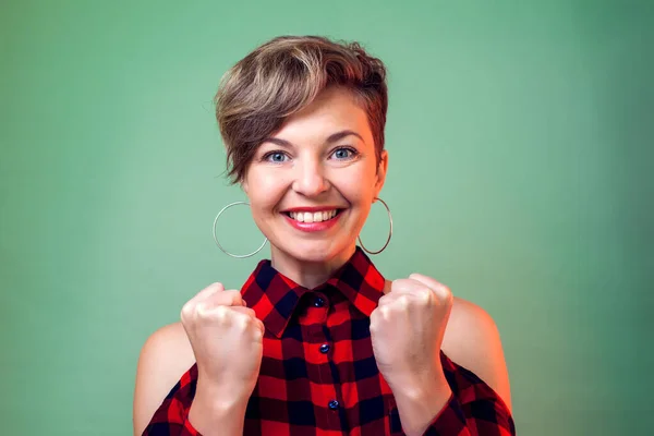People and emotions - a portrait of happy young woman with short hair
