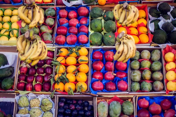Colorful organic fruits in the marketplace. Bright summer background. Healthy food.