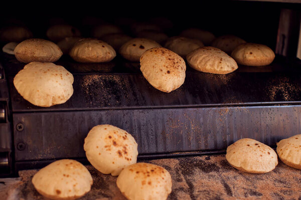 Fresh national arabian bread pita in the bakery.