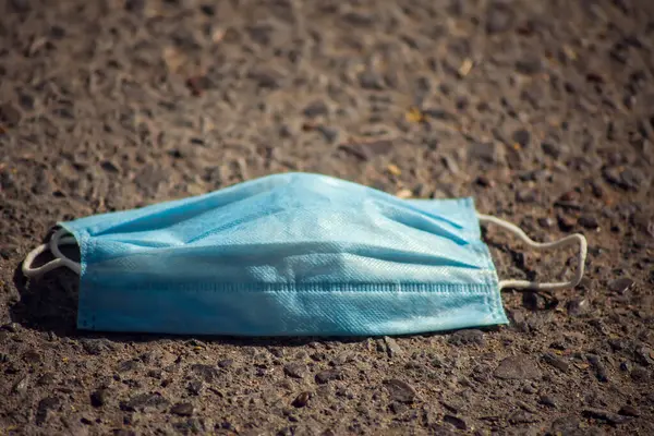 Used Medical Face Mask Garbage Ground Outdoor Environmental Pollution Concept — Fotografia de Stock