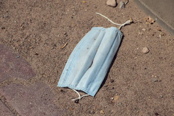 Used Medical Face Mask Garbage Ground Outdoor Environmental Pollution Concept — Fotografia de Stock