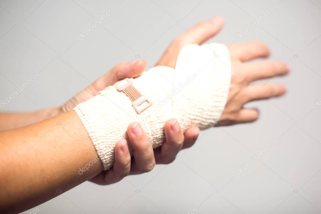 Elastic bandage on hand. Healthcare and medicine concept