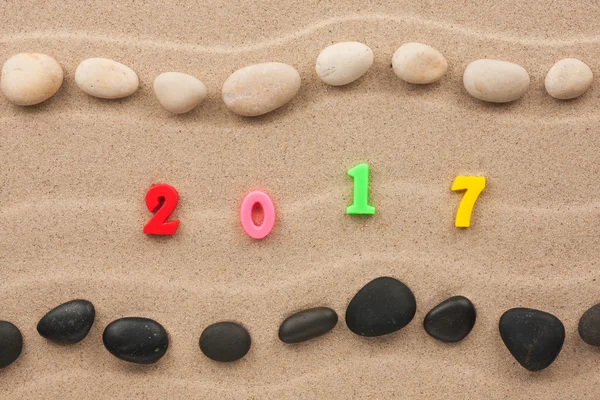 Новий рік 2017 написаний в піску — стокове фото