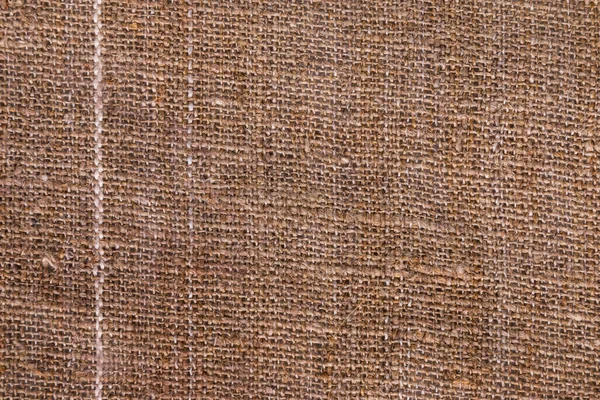 Textura natural de la arpillera con una raya blanca como fondo — Foto de Stock