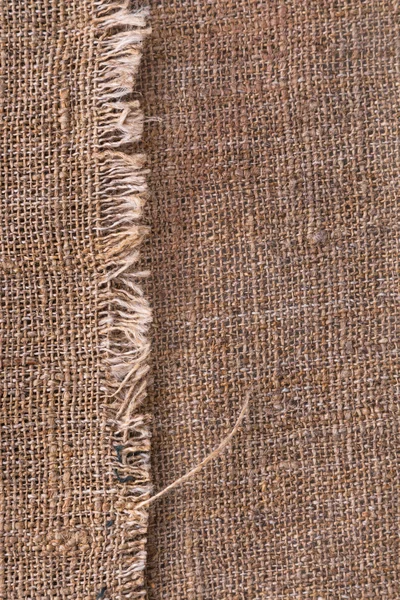 Textura de arpillera natural con bordes rotos con espacio para texto — Foto de Stock