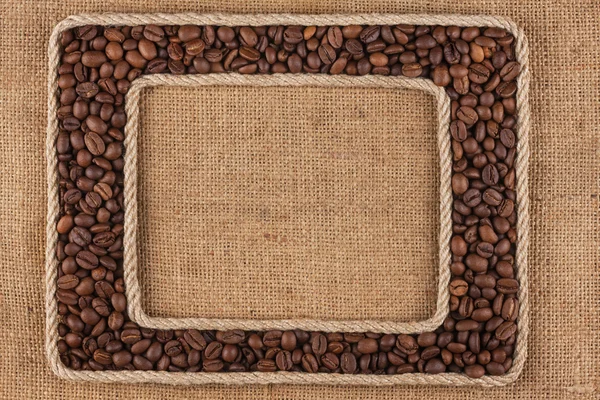 Two frame made of rope with coffee bean on sackcloth — Stock Photo, Image