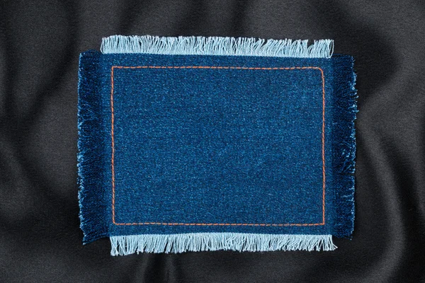 Frame made of denim fabric with yellow stitch on black silk  with space for your text — Stock Fotó