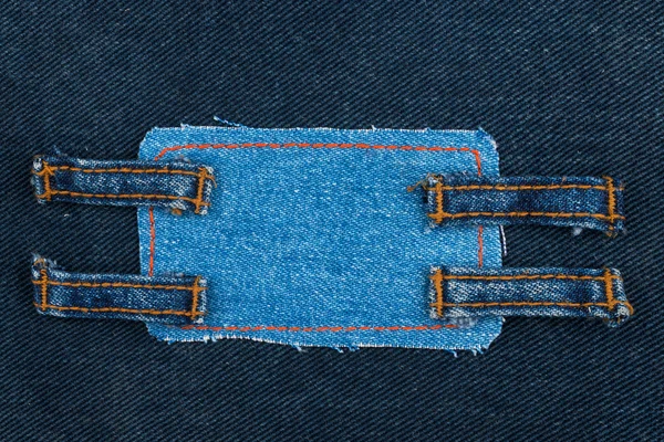 Frame made of denim with four straps of jeans — Stock Photo, Image